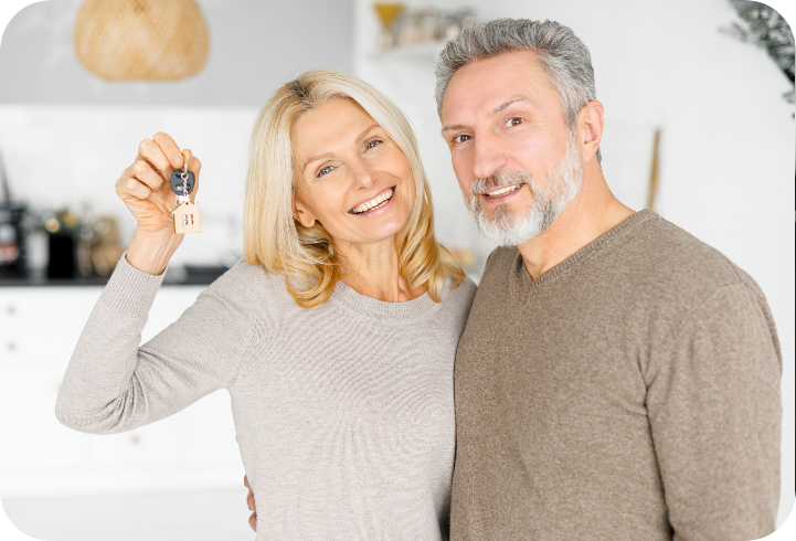 Happy couple holding a set of house keys